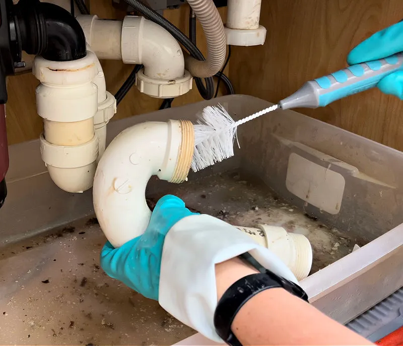 A professional Cleaning-Kitchen-Sink-Pipe-Clog